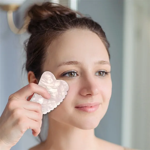 Gua Sha Rosenquarz mit Zähnchen | Großhändler Edelsteine, Heilsteine & Schmuck