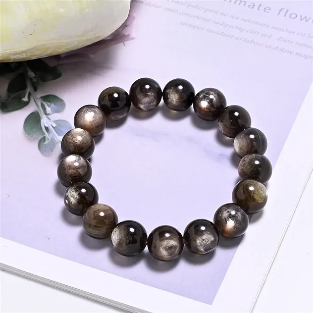 Bracelet, Muscovite (stab.), 12-13mm beads | wholesaler gems & healing stones