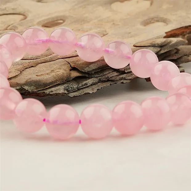 Bracelet, Rose Quartz (extra), 11-12mm beads | wholesaler gems & healing stones