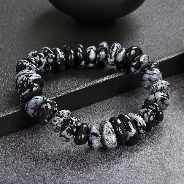 Bracelet, Obsidian (snowflake obsidian), 06-09 x 14-18mm nuggets | Marco Schreier