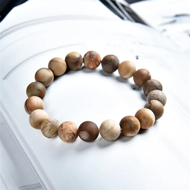 Pulsera, Madera petrificada, cuentas de 10 mm, acabado mate | Marco Schreier