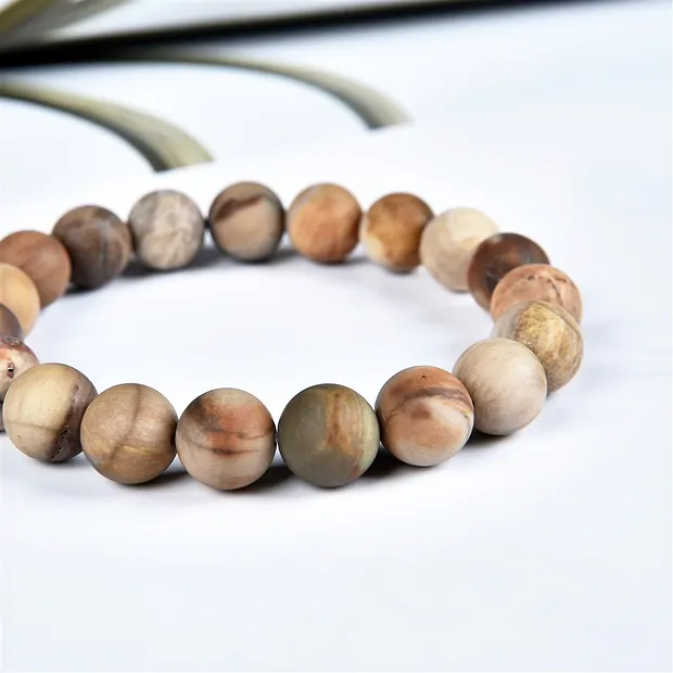 Pulsera, Madera petrificada, cuentas de 10 mm, acabado mate | Marco Schreier