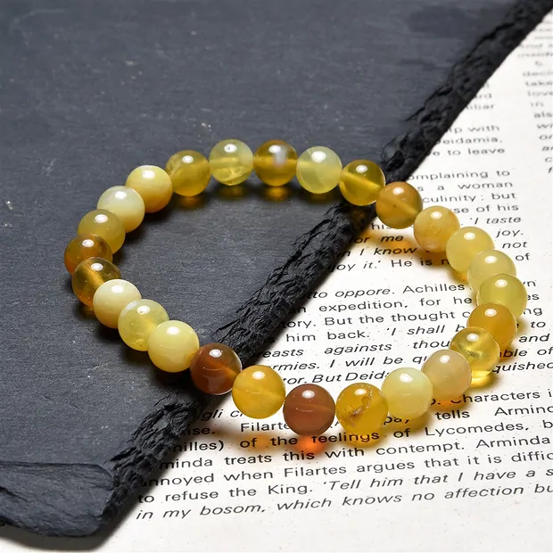 Bracelet, opal (honey opal), 07.5 - 08.0mm spheres | Marco Schreier