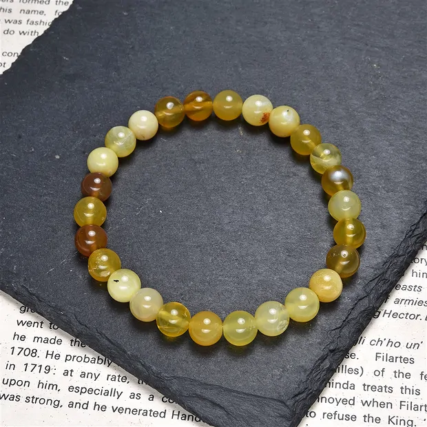 Bracelet, opal (honey opal), 07.5 - 08.0mm spheres | Marco Schreier