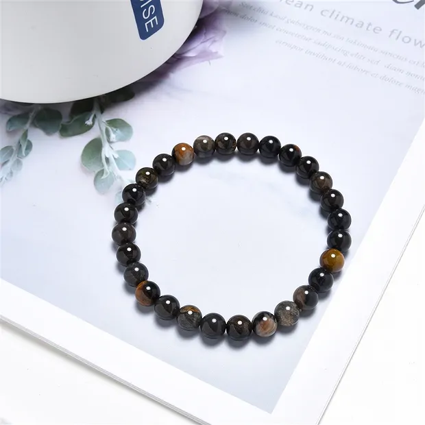 Armband, versteinertes Holz (schwarz), 06mm Kugeln  | Marco Schreier
