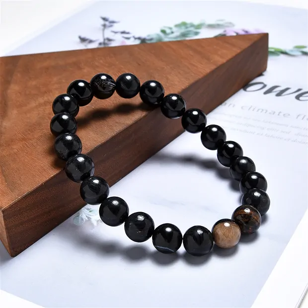 Pulsera, Madera petrificada (negra), cuentas de 10mm, 21cm | Marco Schreier