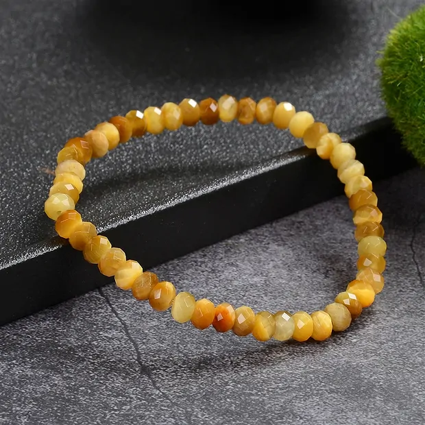 Bracelet, Tiger's Eye (yellow), 04 x 06mm button, faceted | Marco Schreier