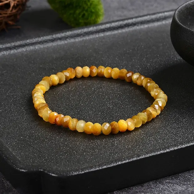 Bracelet, Tiger's Eye (yellow), 04 x 06mm button, faceted | Marco Schreier