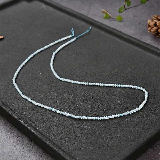 Button strand, Aquamarine, faceted, 01.5 x 02mm | gems, healing stones & jewelry