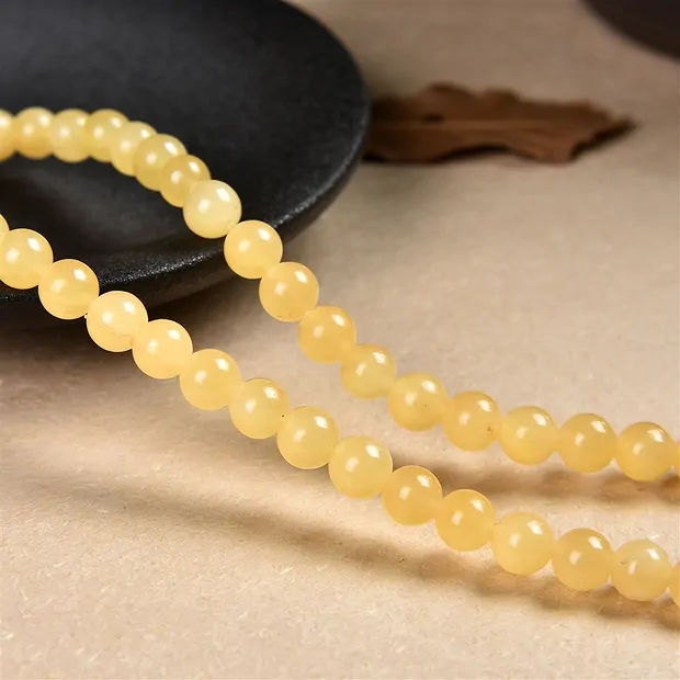 Rang de colliers boules, calcite (orange), 06mm | Marco Schreier