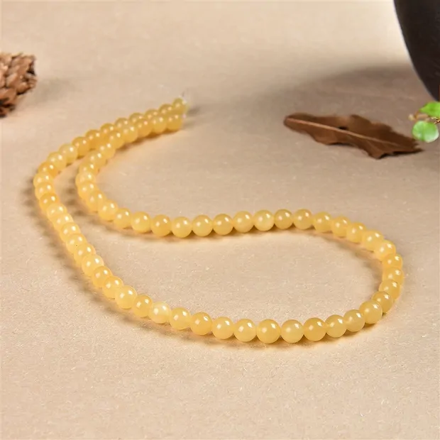 Rang de colliers boules, calcite (orange), 06mm | Marco Schreier