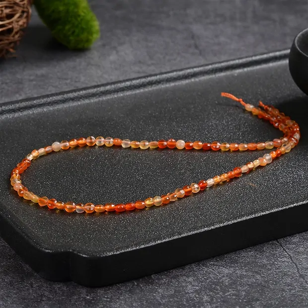Strand Coin, Carnelian (heated), faceted, 04 x 02mm (39cm) | Marco Schreier