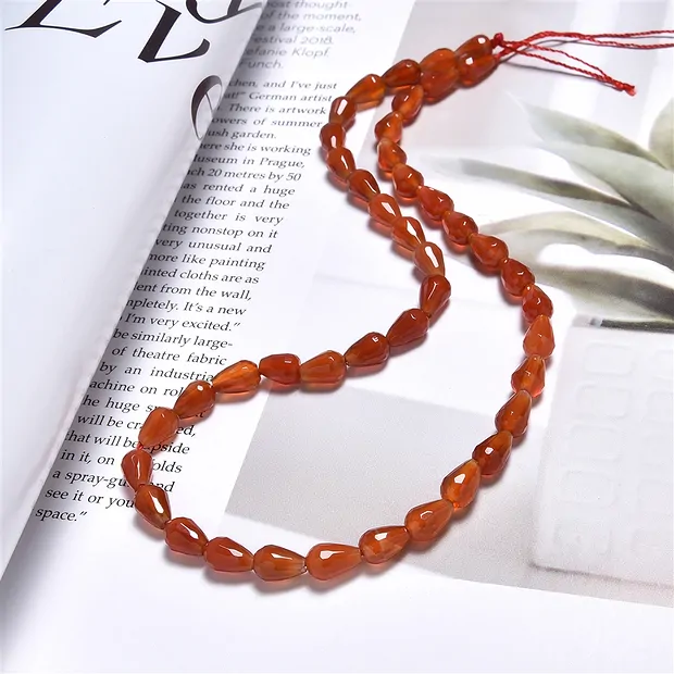Drop strand, carnelian (heated), 09 x 07mm, faceted (39cm) | Marco Schreier