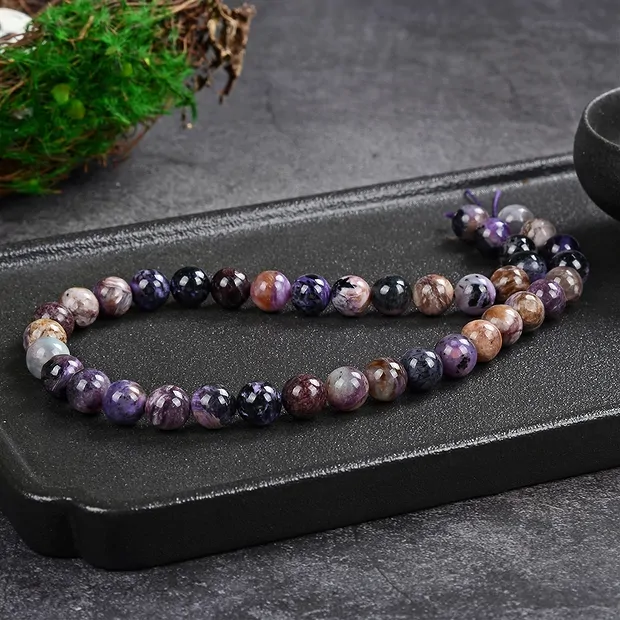 Filo di perline, Charoite (colorate), 10 - 11 mm (39 cm) | Marco Schreier