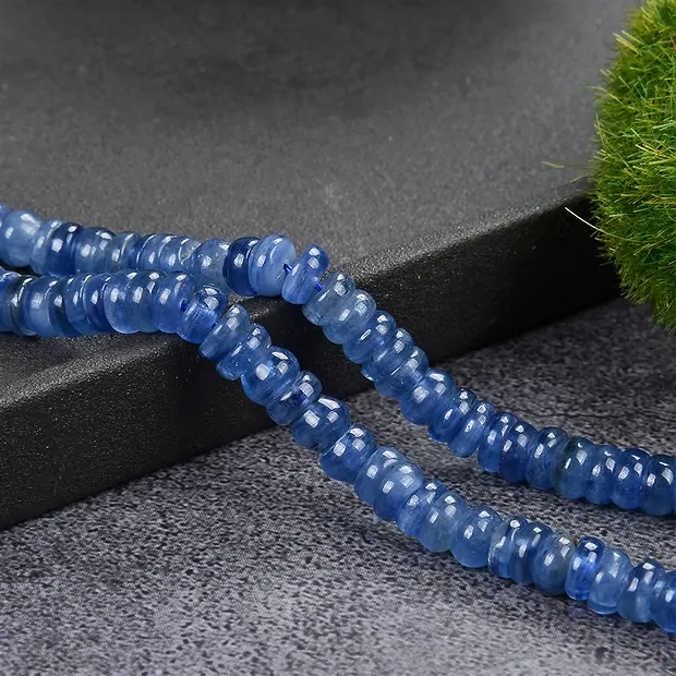 Button strand, Kyanite (stab.) AA, 5.4-6.5 × 2.2-3.8mm | Marco Schreier