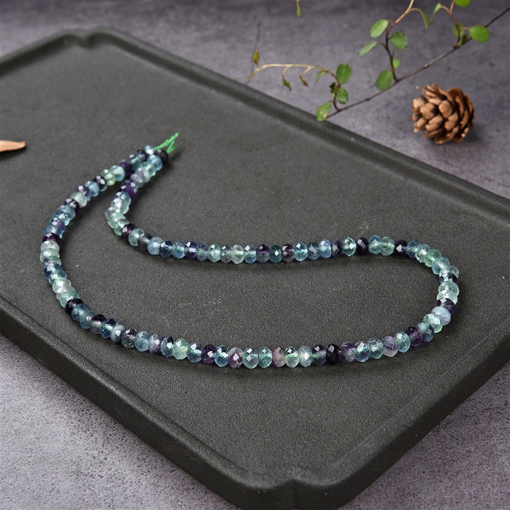 Cordón botón, fluorita, facetado, 04 x 06mm | Marco Schreier