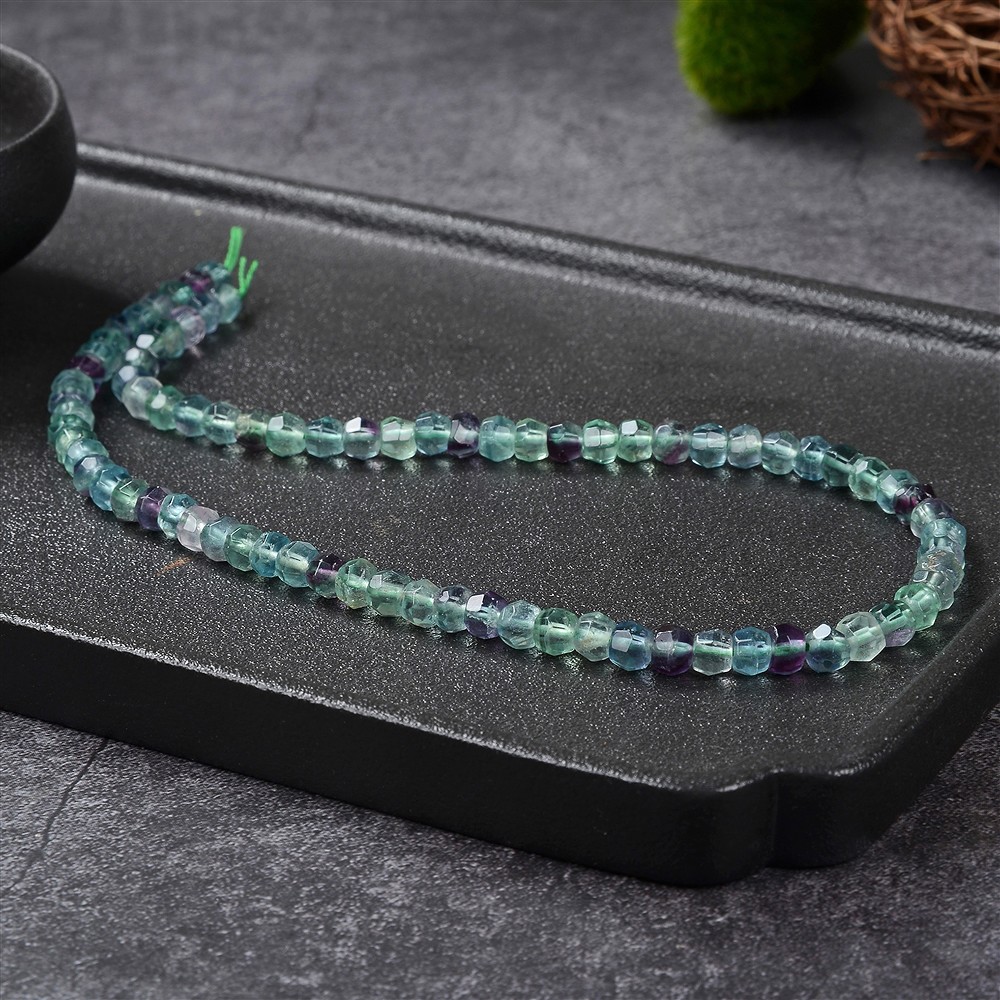 Cordón botón, fluorita, 05 x 06mm, facetado | Marco Schreier