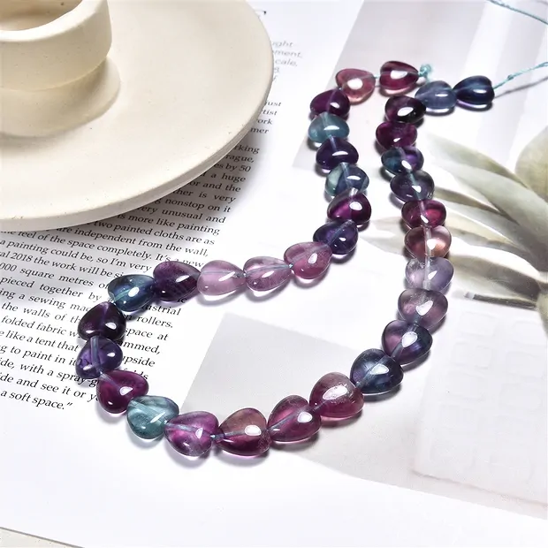 Strang Herzen, Fluorit, 12mm | Mineralienhandel Edelsteine, Heilsteine & Schmuck