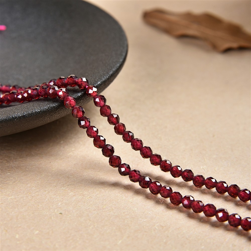 Lense strand, garnet, faceted, 03 x 04mm | wholesaler gems & healing stones