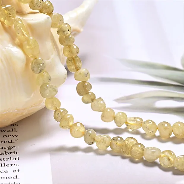 Filo di pepite, granato (giallo), 05 - 06 mm rotondo (39 cm) | Marco Schreier