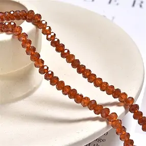 Strang Button, Hessonit (Granat), facettiert, 03 x 04mm (39cm) | Marco Schreier