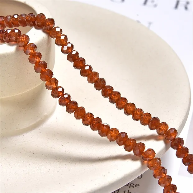 Rang de colliers, hessonite (grenat), facetté, 03 x 04mm (39cm) | Marco Schreier
