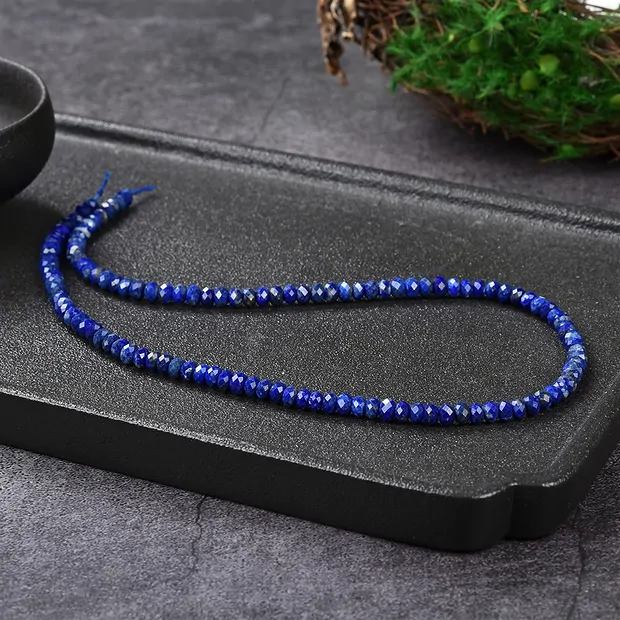 Collar de botones, Lapislázuli A+, facetado, 03 x 05mm | Marco Schreier