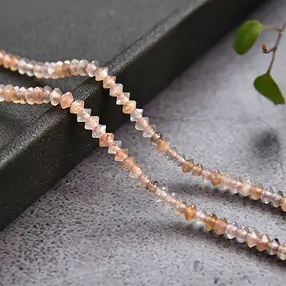 Button/disc strand, Moonstone, faceted, 02 x 03mm | Marco Schreier