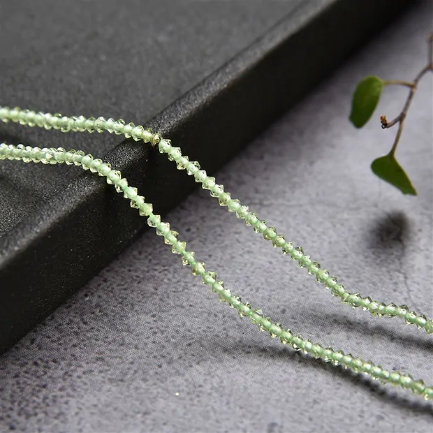 Rang de colliers Boutons/Disque, Péridot, facetté, 01 x 02mm (33cm) | Marco Schreier