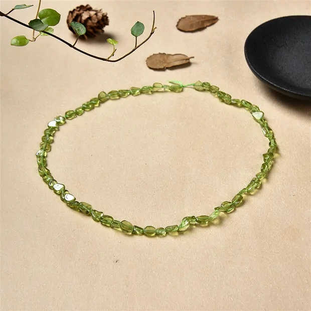 Strang Pebbles, Peridot A, 07 x 04mm | Schreier Edelsteine, Heilsteine & Schmuck