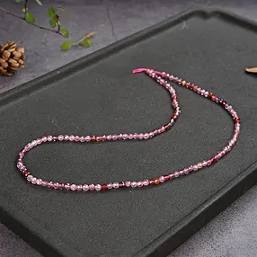 Rang de colliers boules, Spinelle (rose-rouge), à facettes, 03mm | Marco Schreier