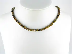 Rang de colliers boules, Oeil-de-tigre, à facettes, 06mm | Marco Schreier