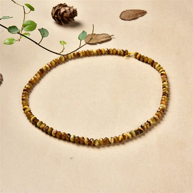 Filo di bottoni, Occhio di tigre (giallo), sfaccettato, 05 x 08 mm (38 cm) | Marco Schreier