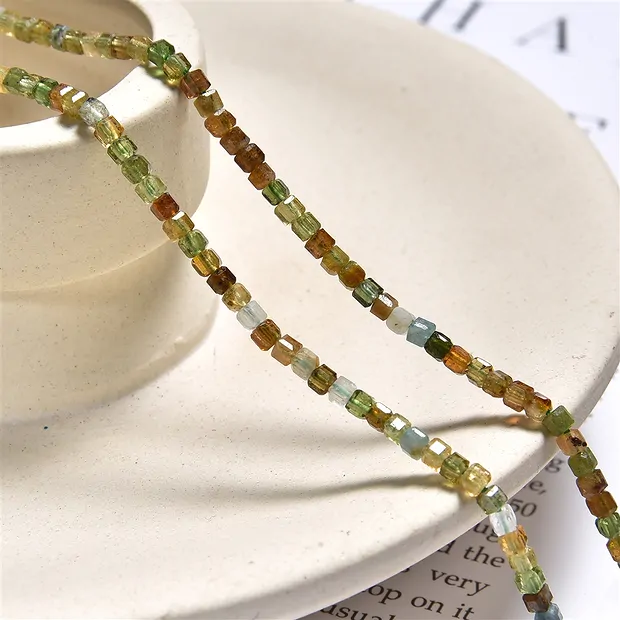 Stringed beads, Tourmaline (yellow/green), 02mm, faceted (39cm) | Marco Schreier