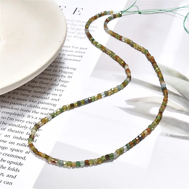 Stringed beads, Tourmaline (yellow/green), 02mm, faceted (39cm) | Marco Schreier