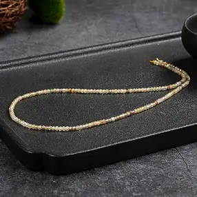 Button strand, Zircon (natural, gold-brown), faceted, 02 x 03mm | Marco Schreier
