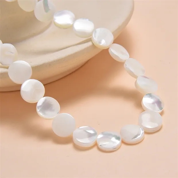 Coin strand, Mother of Pearl (light), 10mm | wholesaler gems & healing stones