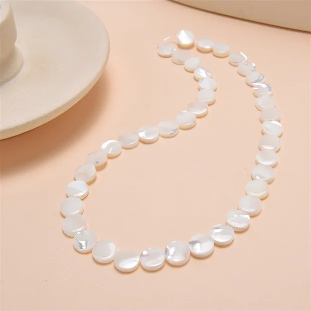 Coin strand, Mother of Pearl (light), 10mm | wholesaler gems & healing stones