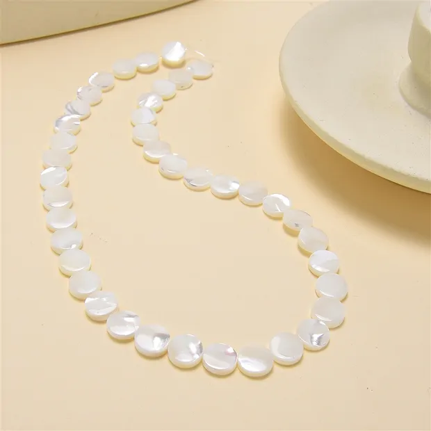 Coin strand, Mother of Pearl (light), 10mm | wholesaler gems & healing stones