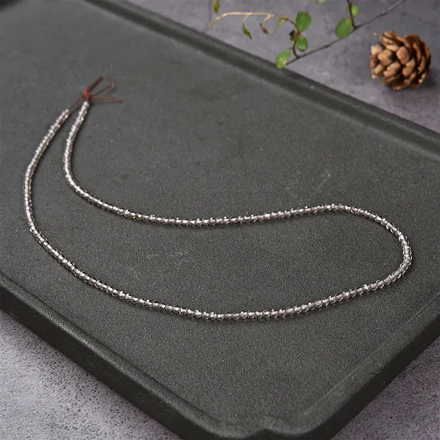 Strang Kugeln, Obsidian (Rauch), facettiert, 02,5mm (39cm) | Marco Schreier