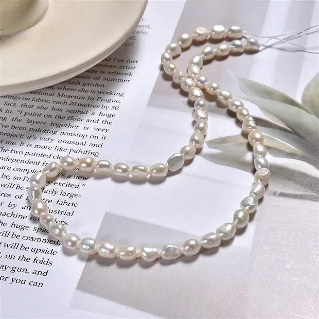 Rang de colliers Freeform plat, perle d'eau douce, blanc-crème, 06 - 07mm | Marco Schreier
