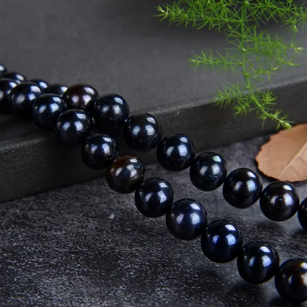 Strand Potatoe round, freshwater pearl petrol (dyed), 09-10mm (39cm) | Marco Schreier