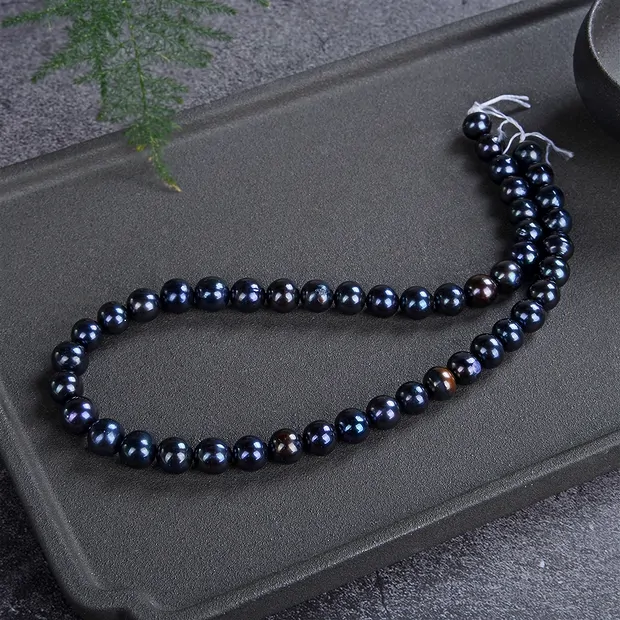 Strand Potatoe round, freshwater pearl petrol (dyed), 09-10mm (39cm) | Marco Schreier