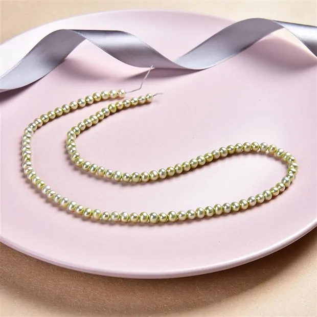 Strand Potatoe, freshwater pearl A, green (dyed), 05mm | Marco Schreier