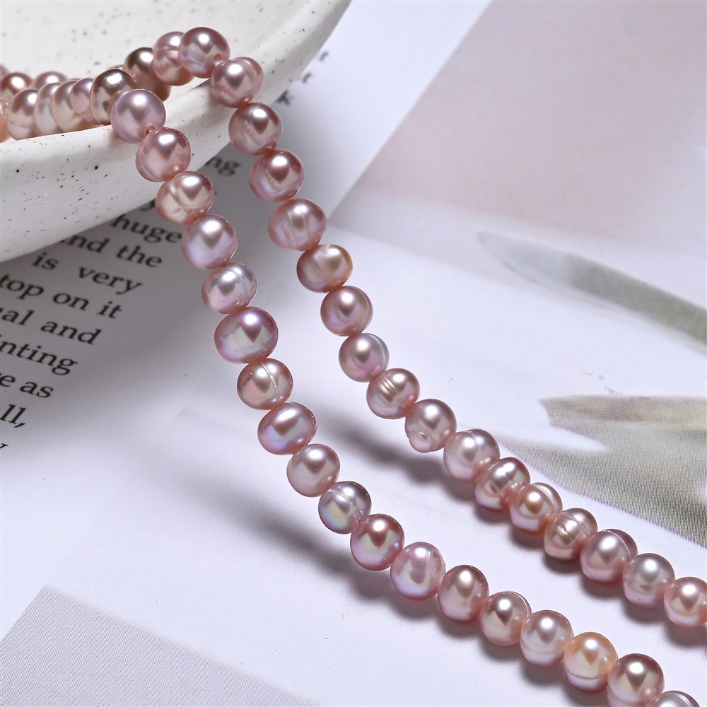 Strang rund, Süßwasser-Perle, violett (gef.), 04 - 05mm (39cm) | Marco Schreier