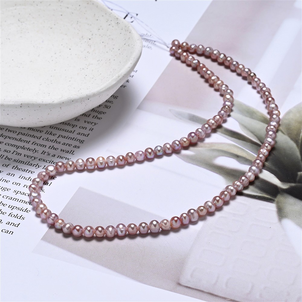 Strang rund, Süßwasser-Perle, violett (gef.), 04 - 05mm (39cm) | Marco Schreier