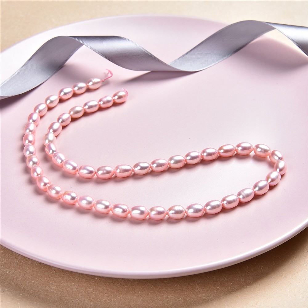 Strand of rice grain, freshwater pearl, pink (dyed), 07-09 x 06-07mm | Marco Schreier