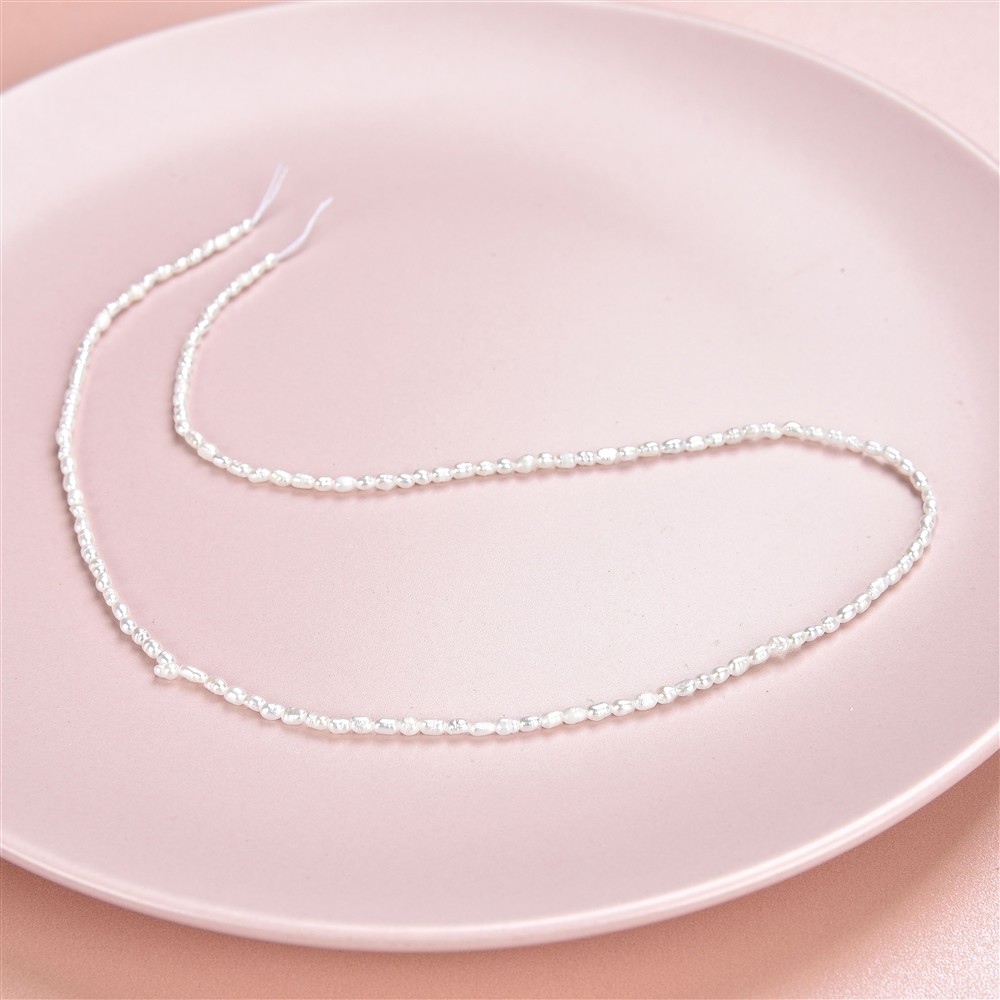 Rang de collier grain de riz, perle d'eau douce, blanc-crème, 02 - 02,3mm | Marco Schreier