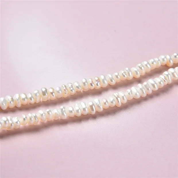 Collar de botones, perla de agua dulce AB, blanca, 02-03 x 03-04mm | Marco Schreier