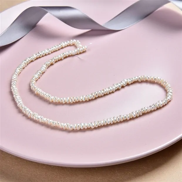 Collar de botones, perla de agua dulce AB, blanca, 02-03 x 03-04mm | Marco Schreier